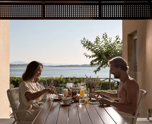 Eagles Villas Chalkidiki Ocean Villa with terrace and couple taking breakfast